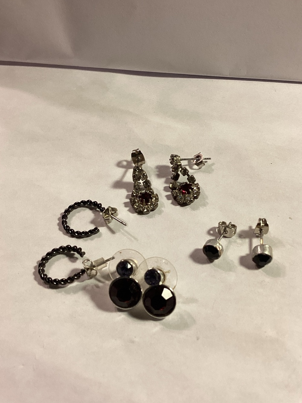 4 pair of earrings, silver toned